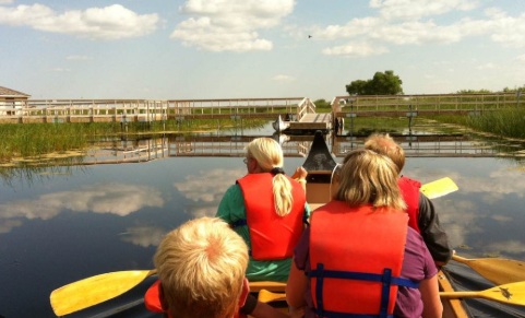 Children canoeing at Oak Hammock Marsh wetland